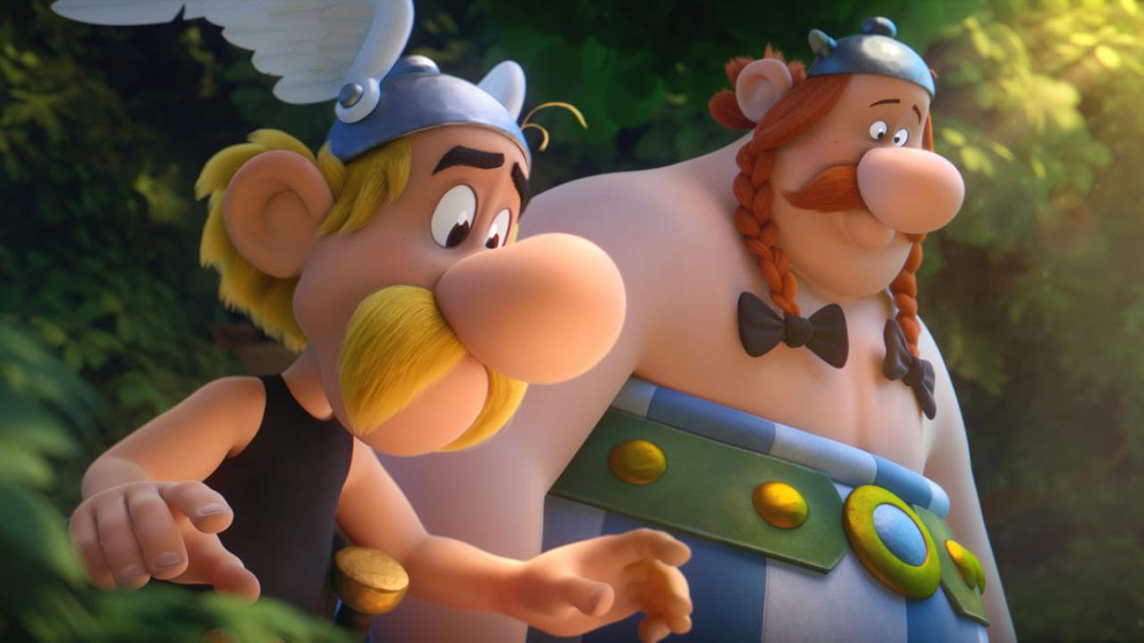 Der Gallier Asterix mit gelben Schnurrbart steht neben seinem dicken Kumpel Obelix